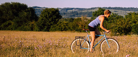Kate Cycling through field